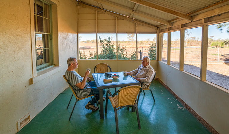 Guests having tea on the enclosed back verandah at Mount Wood Homestead. Photo: John Spencer/DPIE