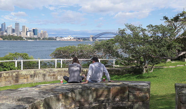 A couple take in views at Bradleys Head – Booraghee, Sydney Harbour National Park. Photo credit: Elinor Sheargold &copy; DPIE