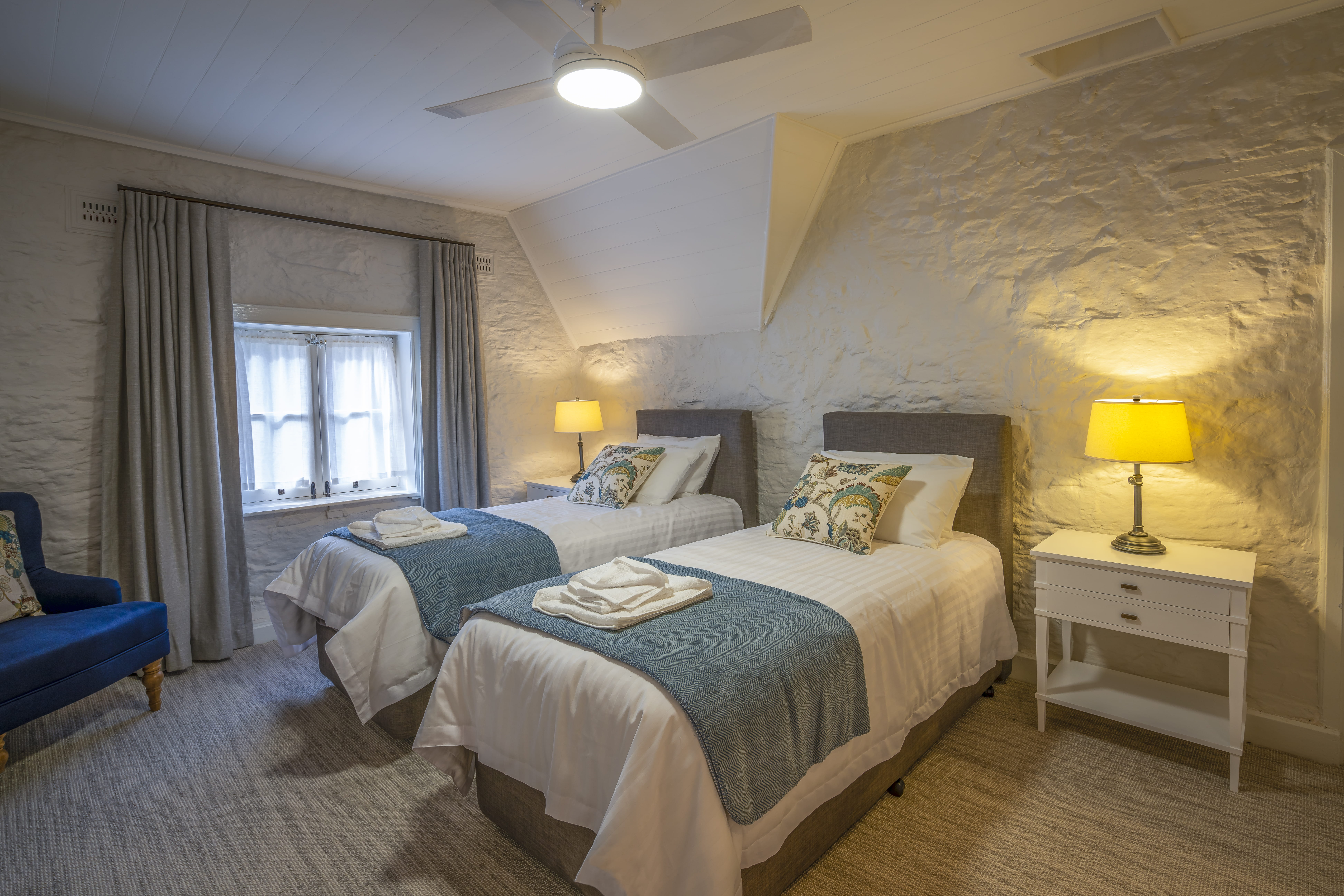 A bedroom with 2 single beds at Gardeners Cottage, Sydney Harbour National Park. Photo:  John Spencer/DPIE