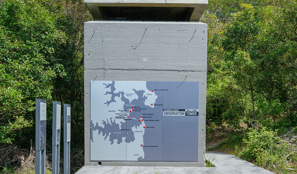 The facinating stories on signage around the restored Observation Tower at Georges Head promotes conversations between people walking by. Credit: Simon Wood &copy; DCCEEW 