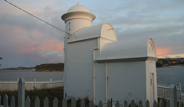 Grotto Point lighthouse at sunset overlooking Sydney Harbour. Photo: OEH/Natasha Webb