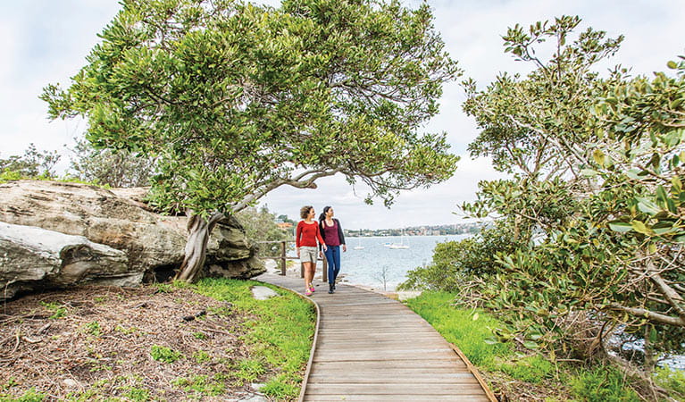Friends walking on Hermitage Foreshore track in Nielsen Park. Photo: Simone Cottrell &copy; OEH