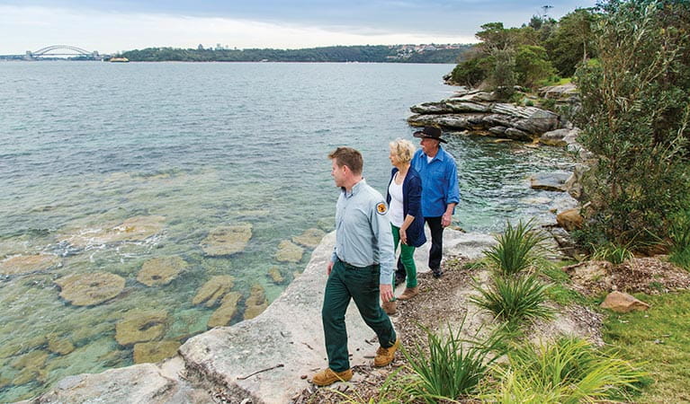 Ranger and park visitors on Hermitage Foreshore track in Nielsen Park. Photo: Simone Cottrell/DPIE