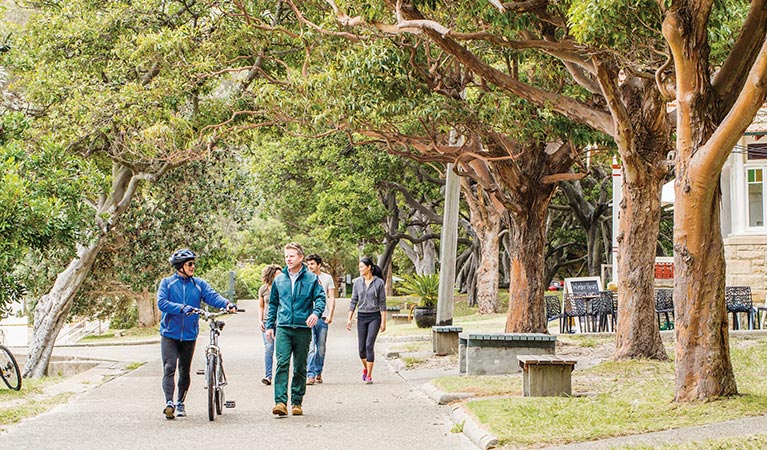 Ranger and park visitor walking along the path in Nielsen Park. Photo: Simone Cottrell/DPIE