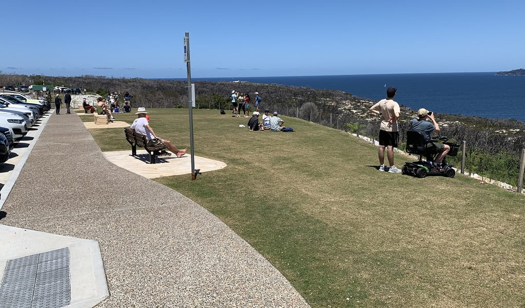 Visitors taking in ocean views at North Head lookout, Sydney Harbour National Park. Photo: Katherine Ashley &copy; DPE