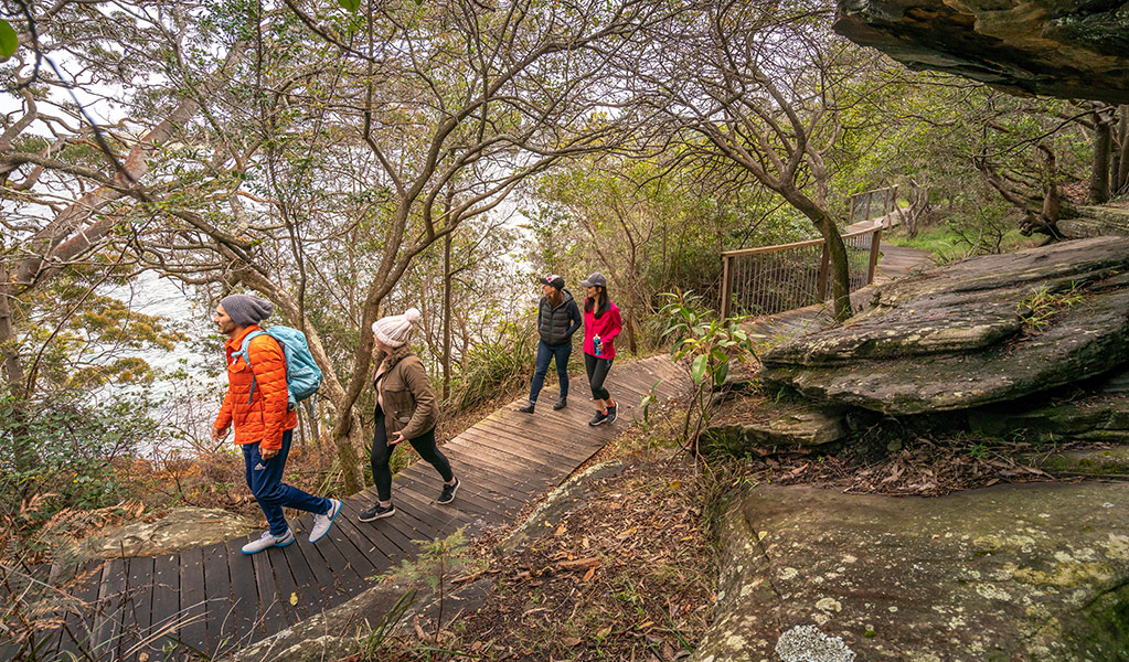 Walkers on Hermitage Foreshore track, near Nielsen Park. Credit: John Spencer &copy; DCCEEW