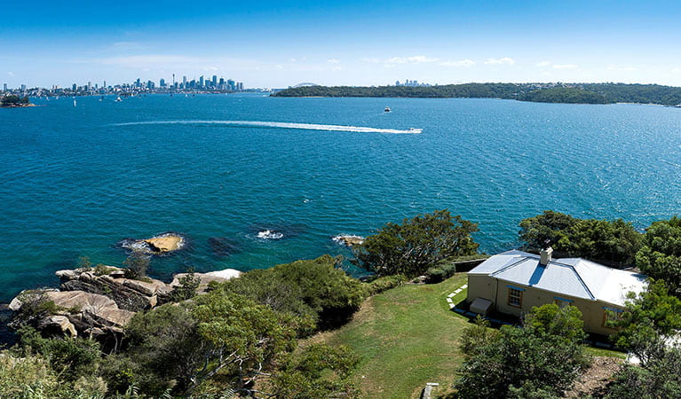 Aerial view of Steele Point Cottage at Vaucluse in Sydney Harbour National Park, with city skyline in distance. Photo: G Pickford/OEH