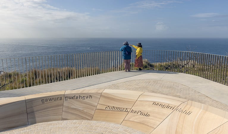 Walkers look out from the viewing platform at Yiningma lookout, North Head, Sydney Harbour National Park. Photo: John Spencer &copy; DPE