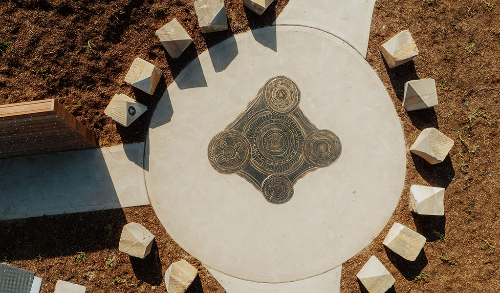 Aerial photo showing people on the boardwalk at Birubi Point Aboriginal Place and the cultural artwork by Worimi man, Gerard Black. Credit: Daniel Parsons &copy; Daniel Parsons