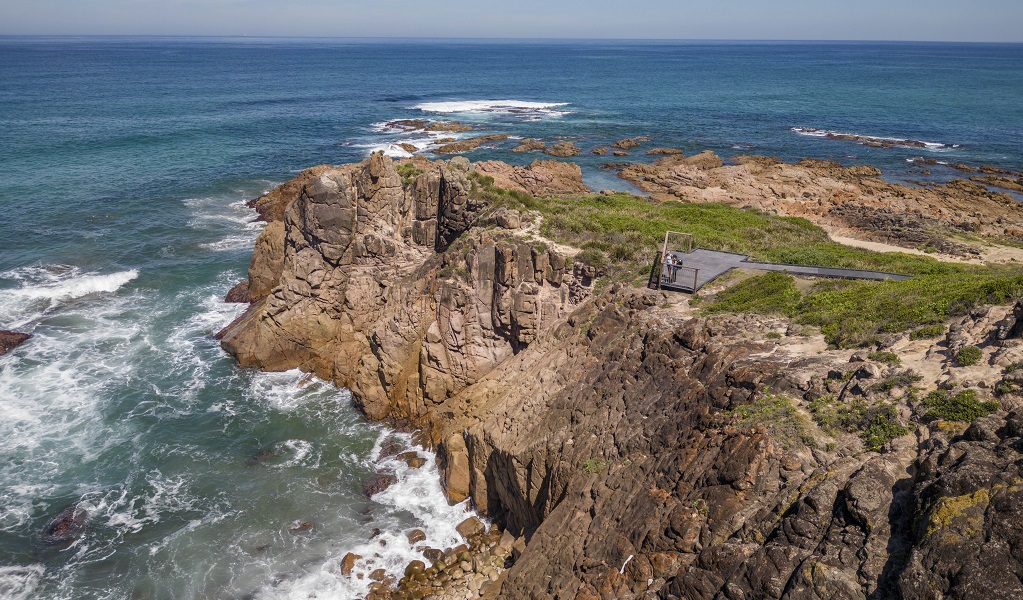 A lookout perched on the rugged cliff edge along Tomaree Coastal walk, near Iris Moore lookout and picnic area in Tomaree National Park. Photo: John Spencer &copy; DPE