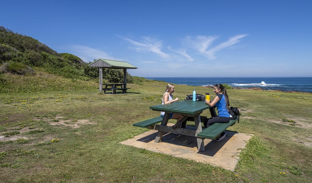 Walkers take a break at Iris Moore lookout and picnic area in Tomaree National Park. Photo: John Spencer &copy; DPE
