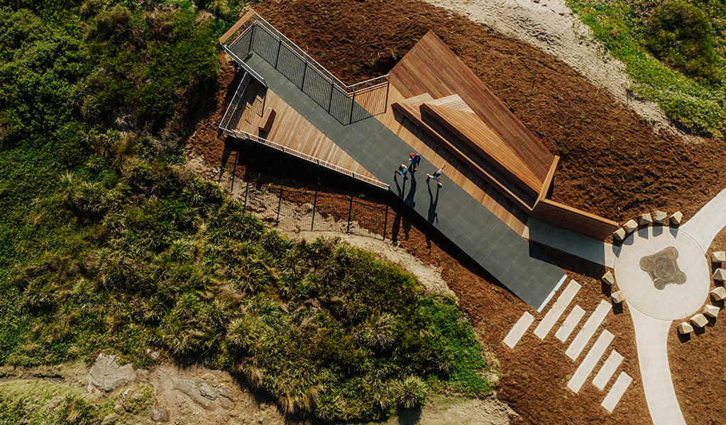 Aerial photo showing people on the boardwalk at Birubi Point Aboriginal Place and the cultural artwork by Worimi man, Gerard Black. Credit: Daniel Parsons &copy; Daniel Parsons