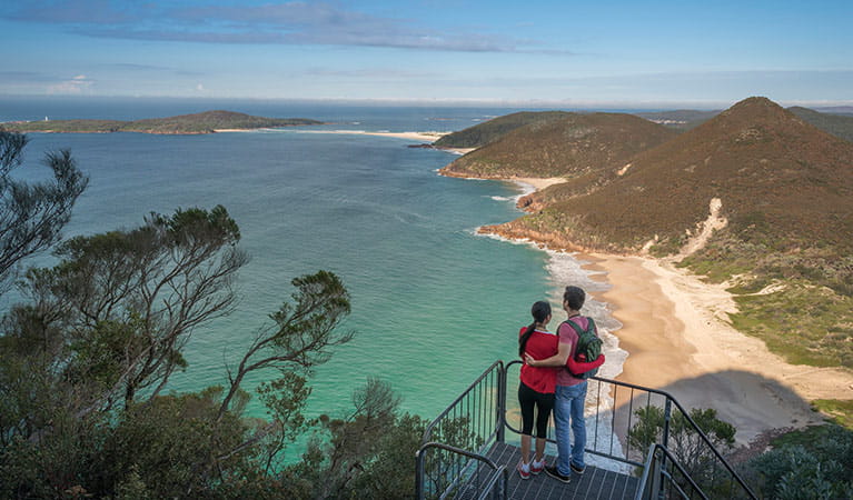 Couple at the lookout enjoying views of Zenith beach. Photo: John Spencer &copy; OEH