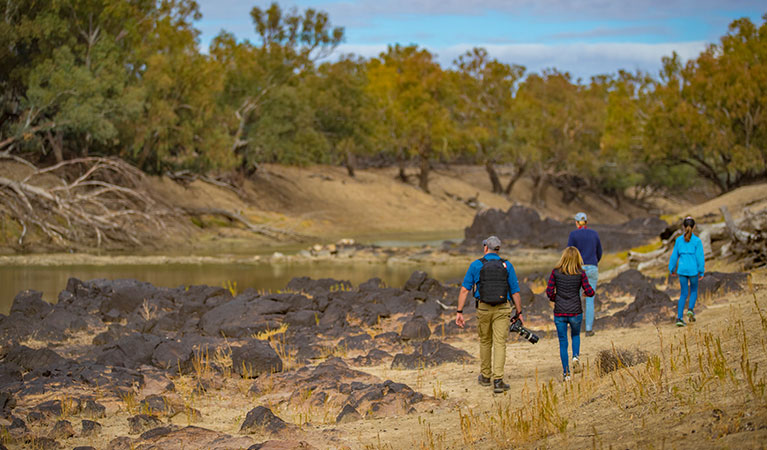 A family walk beside the Darling River, Toorale National Park. Photo: Joshua Smith/OEH.