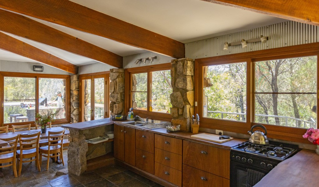 The kitchen and dining table at Muluerindie in Warrabah National Park. Photo: Joshua Smith &copy; DPE