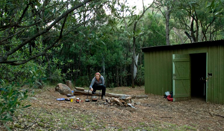 A camper at Balor Hut campground in Warrumbungle National Park. Photo: OEH