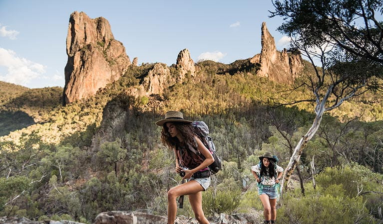 Two women hike the Breadknife and Grand High Tops walk in Warrumbungle National Park. Photo &copy; Robert Mulally