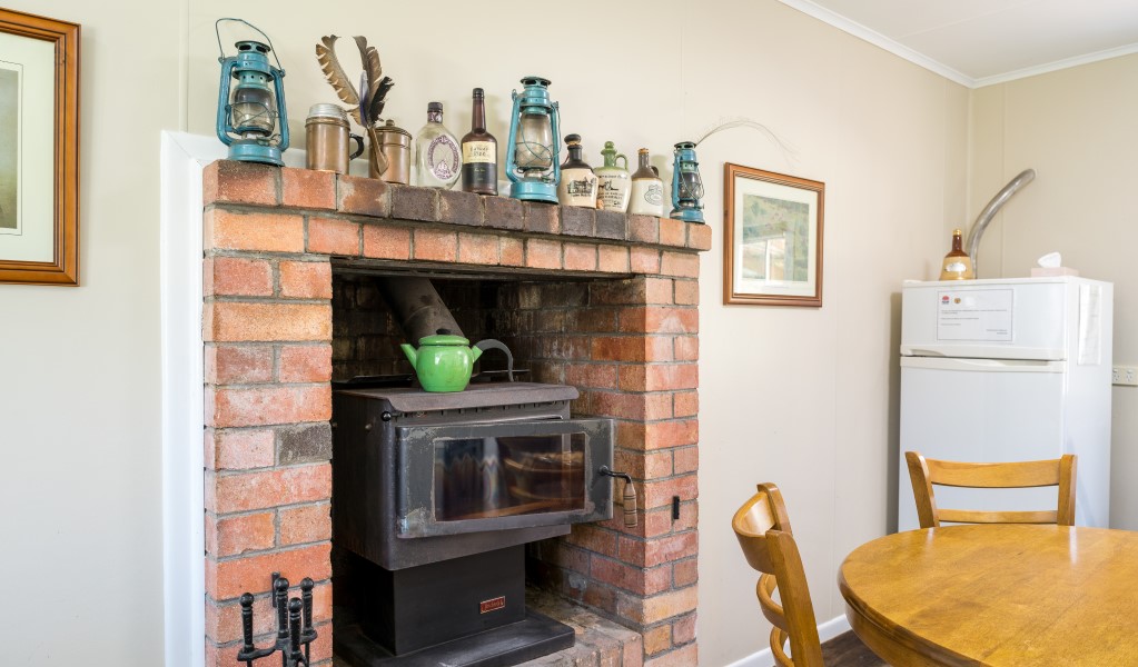 The indoor wood heater at Four Bull Hut in Washpool National Park. Photo &copy; DPE