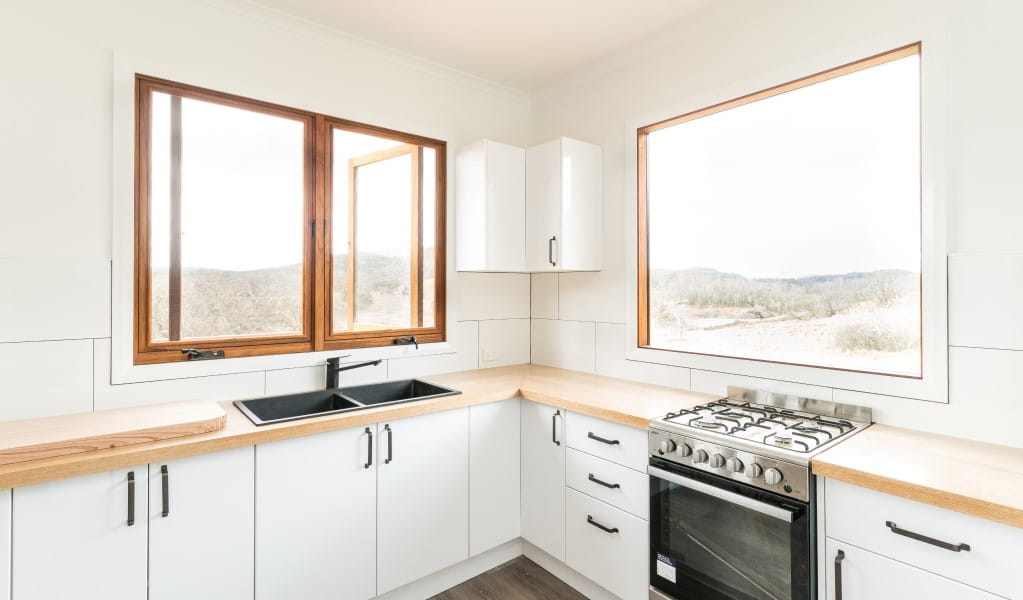 The kitchen at Mooraback Cabin looking out towards Werrikimbe National Park. Photo: David Waugh &copy; DPE
