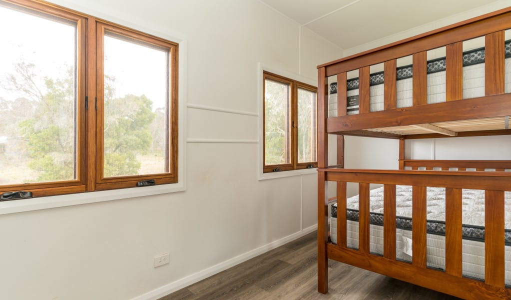 A bedroom with bunk beds at Mooraback Cabin in Werrikimbe National Park. Photo: David Waugh &copy; DPE