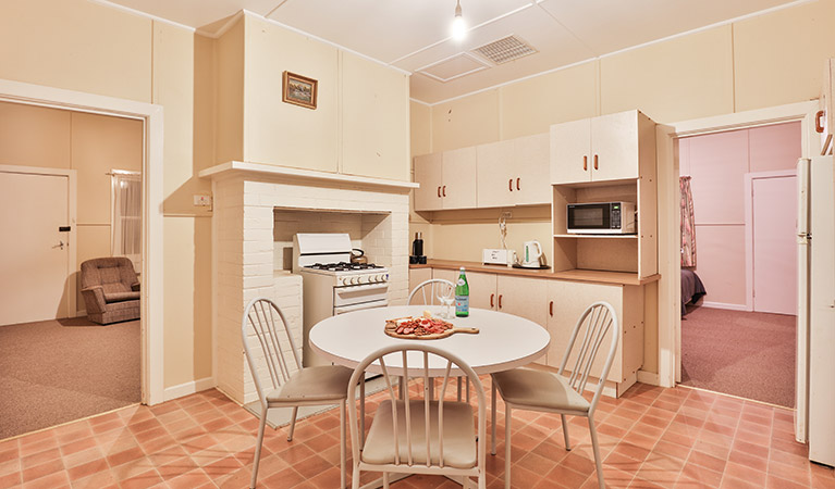 Kitchen and dining table at Willandra Cottage, Willandra National Park. Photo: Vision House Photography/DPIE