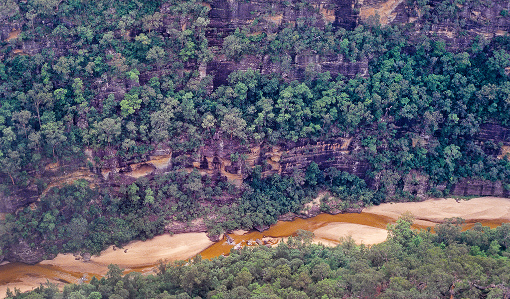 An aerial view of Colo River wilderness gorge and its inland beach in Wollemi National Park near Lithgow. Credit: Simone Cottrell &copy; DCCEEW