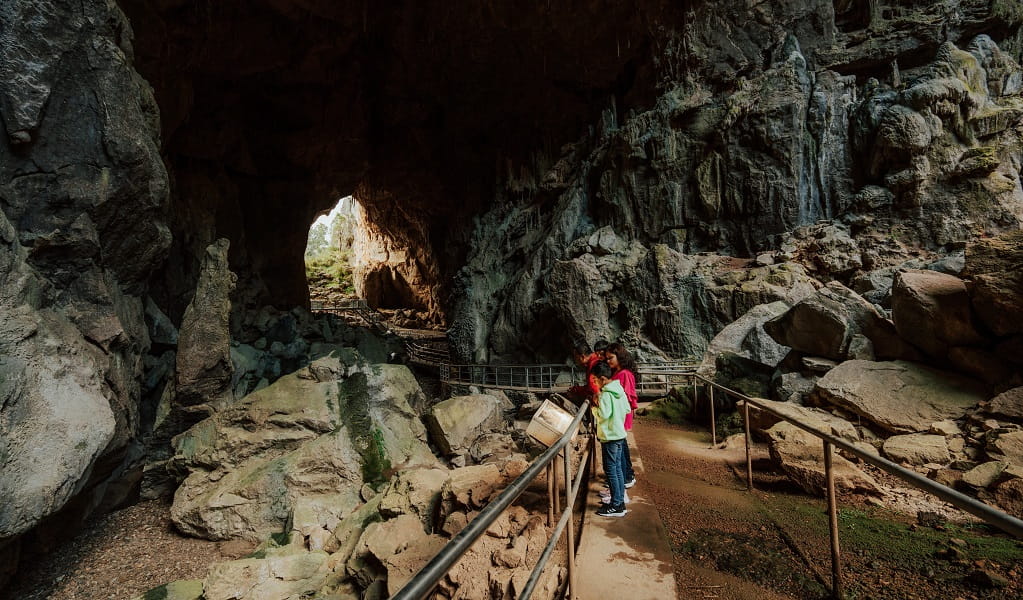 Visitors explore Victoria Arch, the largest chamber of Fig Tree Cave. Credit: Remy Brand/DPE &copy; Remy Brand