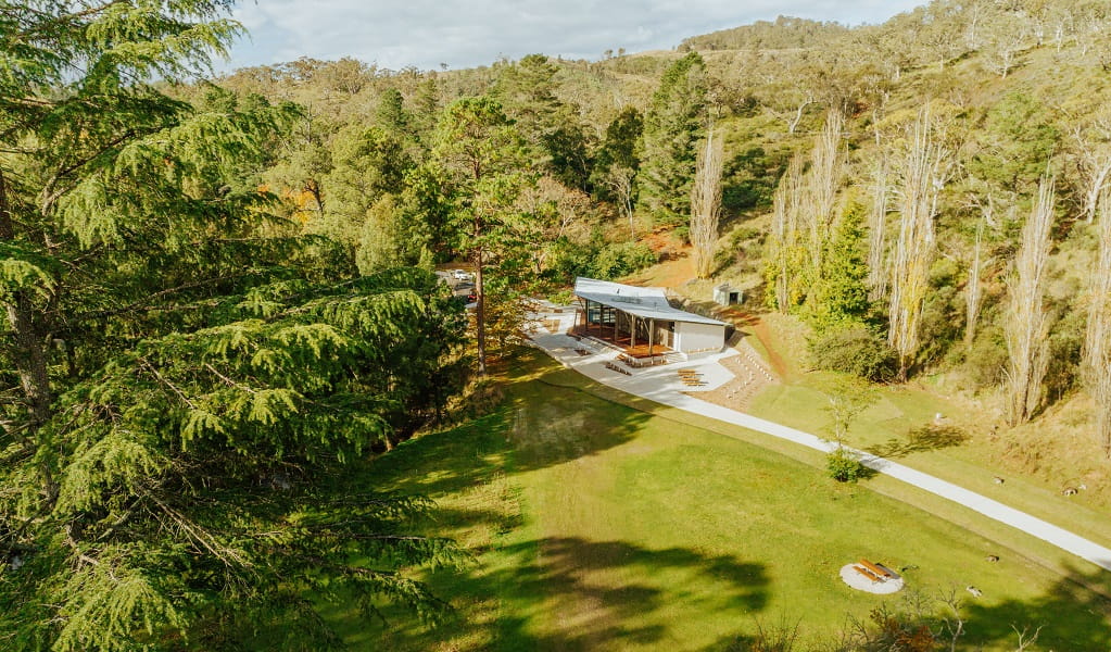 An aerial view of Kui Kiosk surrounded by surrounded by trees, with a peaceful picnic area across the road. Credit: Remy Brand/DPE &copy; Remy Brand