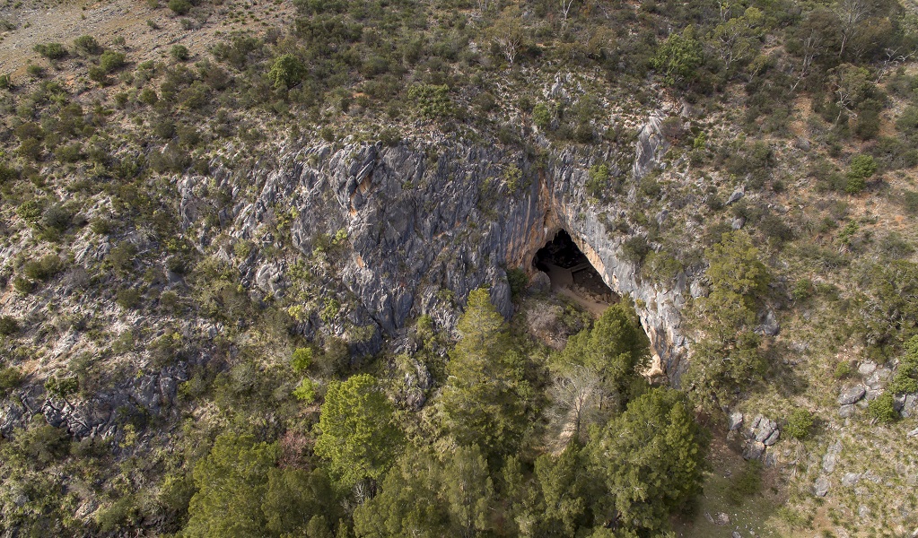 Aerial view of Victoria Arch and the surrounding limestone terrain sparsely covered in trees. Credit: John Spencer © DPE