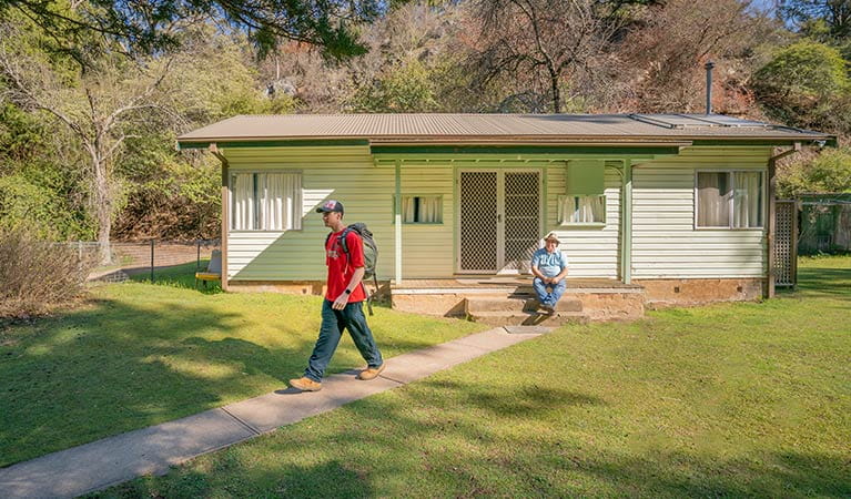 Family sets off to go hiking from Post Office cottage. Photo: OEH/John Spencer