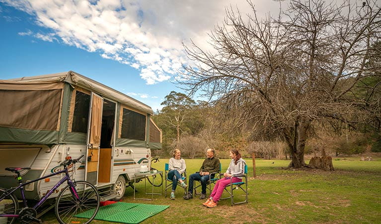 Family with caravan at Wombeyan Caves campground. Photo: John Spencer/OEH