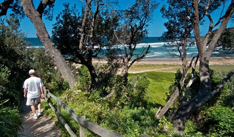 Man walking on the Bateau Bay track. Photo: John Spencer