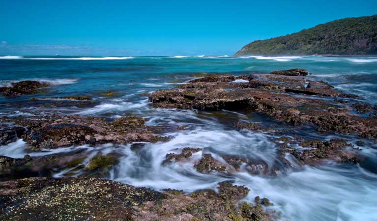 Rocks and water in Bateau Bay, Wyrrabalong National Park. Photo: John Spencer/OEH