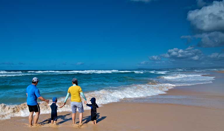 Family at the Pelican Beach shore. Photo: John Spencer/OEH