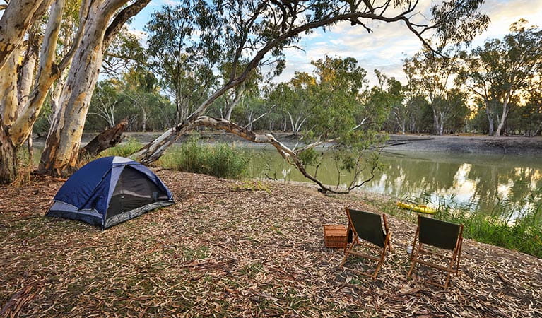 A tent and 2 campchairs overlook the river at Woolpress bend campground, Yanga National Park. Photo: Vision House Photography/OEH