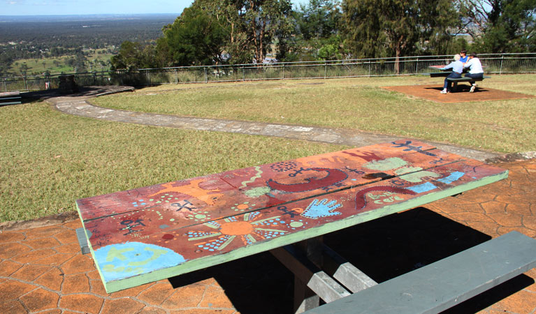 People sitting at the Hawkesbury lookout. Photo: John Yurasek/OEH 