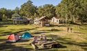 Campers sitting around the fire pit near their tents at Private Town campground in Yerranderie Regional Park. Photo: John Spencer/OEH
