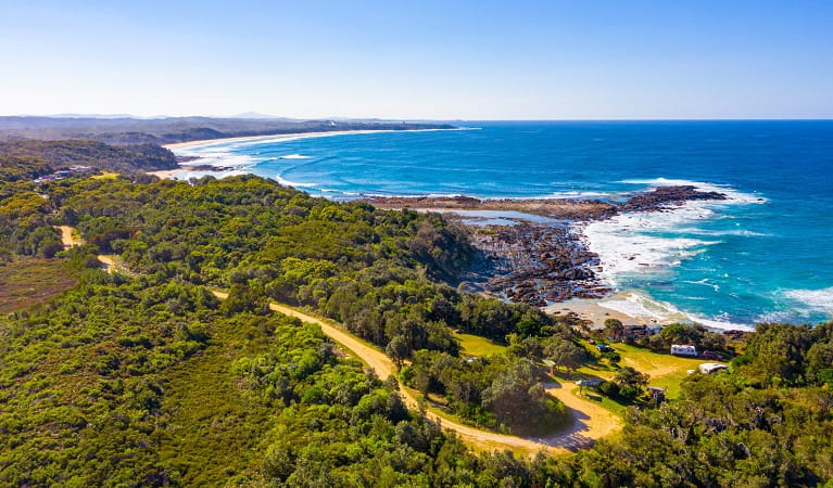 An aerial view of Boorkoom campground with ocean in the background in Yuraygir National Park. Photo: Jessica Robertson &copy; DPIE