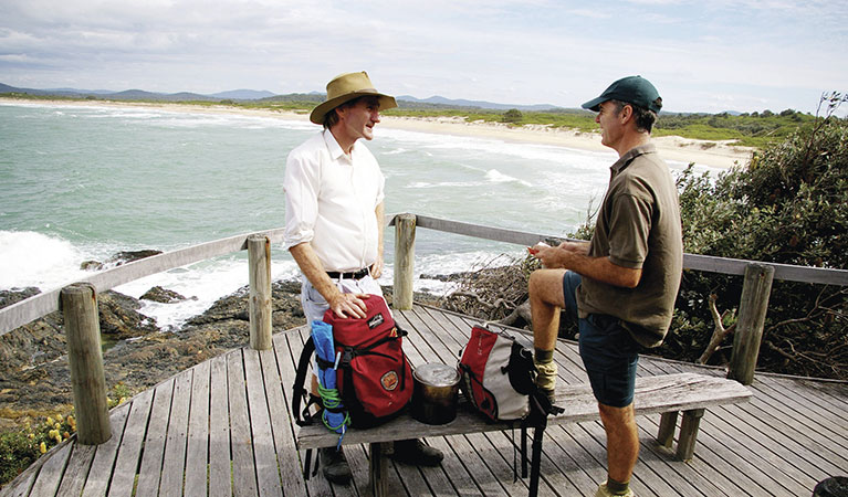 Bushwalkers on wooden deck on a coastal walk near Boorkoom campground in Yuraygir National Park. Photo: Debrah Novak/DPIE 