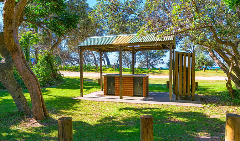 A barbecue under a shelter at Illaroo campground in Yuraygir National Park. Photo: Jessica Robertson &copy; DPIE