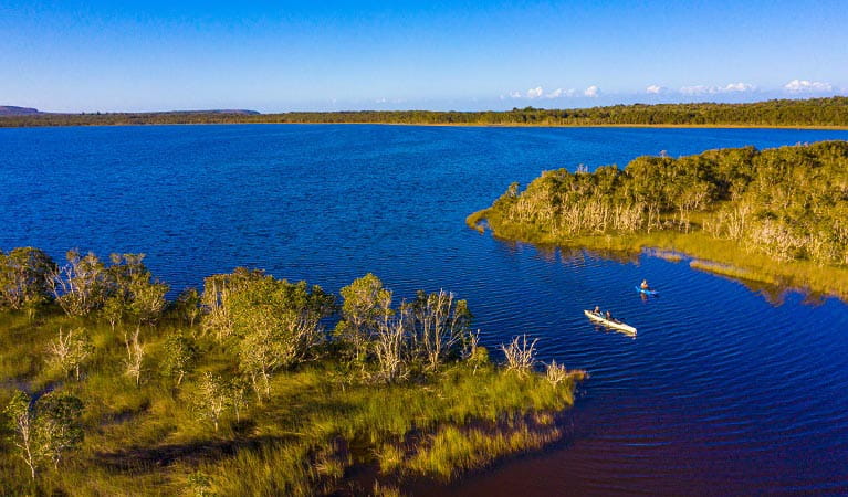 An aerial view of two people canoeing in Lake Arragan. Photo: Jessica Robertson