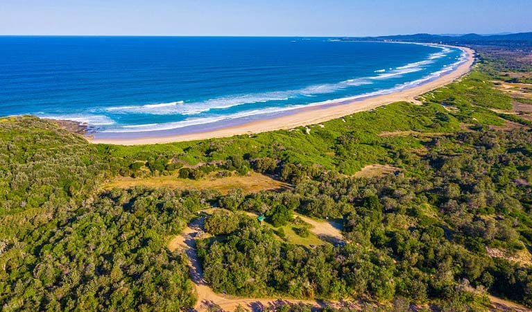 An aerial short of Wilsons Headland picnic area with the ocean in background. Photo: Jessica Robertson