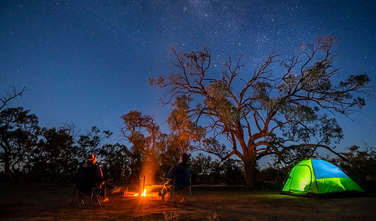 Tent and campfire at Emu Lake campground in Kinchega National Park. Photo: John Spencer &copy; DPIE