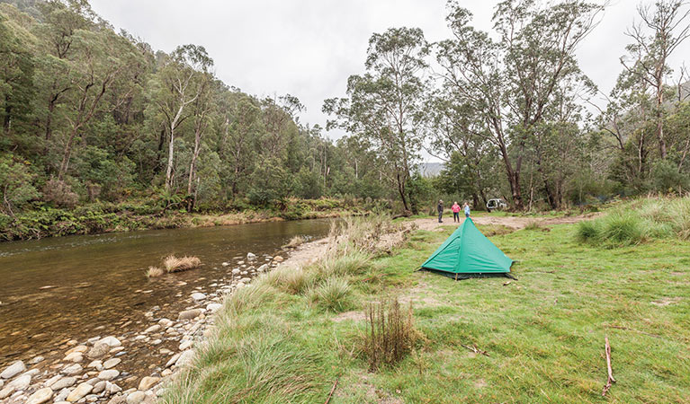 People camping beside the river at YHA Hut in Kosciuszko National Park. Photo: Murray Vanderveer/DPIE