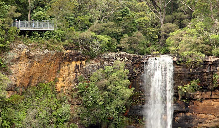 People looking at Fitzroy Falls from Jersey lookout in Morton National Park. Photo: John Yurasek/DPIE