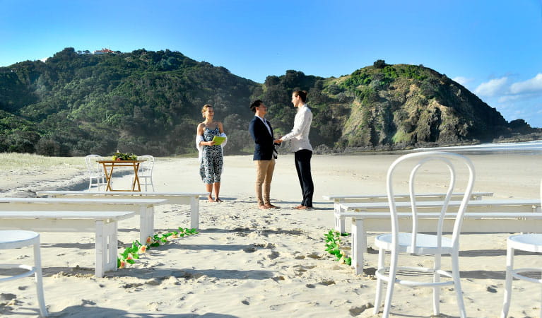 A couple saying their vows at Cosy Corner at Tallow Beach, Cape Byron State Conservation Area. Photo: Fiora Sacco &copy; DPIE