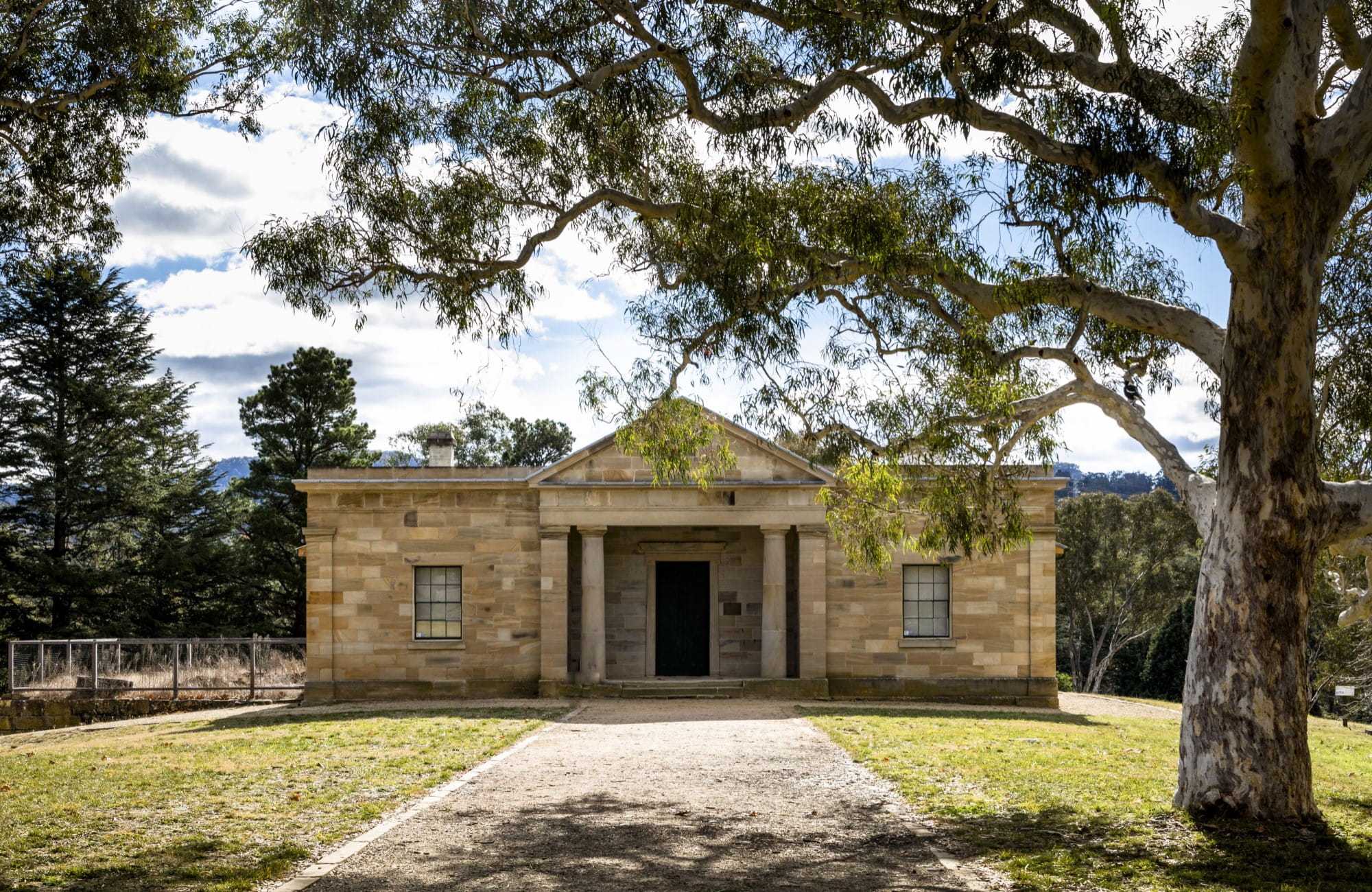 The exterior of Hartley Courthouse, framed by trees in Hartley Historic Site. Photo: Jennifer Leahy &copy; DPIE