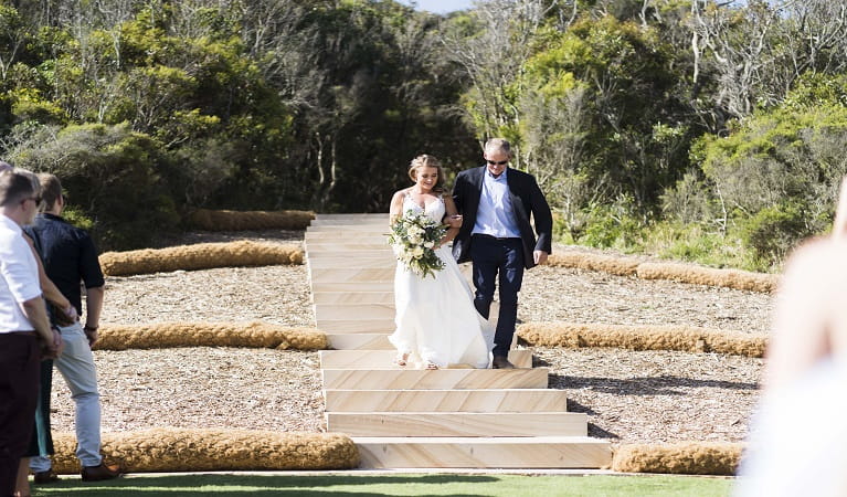 Father walking bride down the sandstone steps at Hickson Street lookout. Photo: Michael Delore &copy; Michael Delore