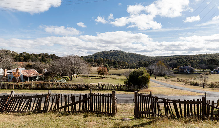 The fence and surrounding countryside at Sacred Heart Church in Hill End Historic Site. Photo: Jennifer Leahy &copy; DPE