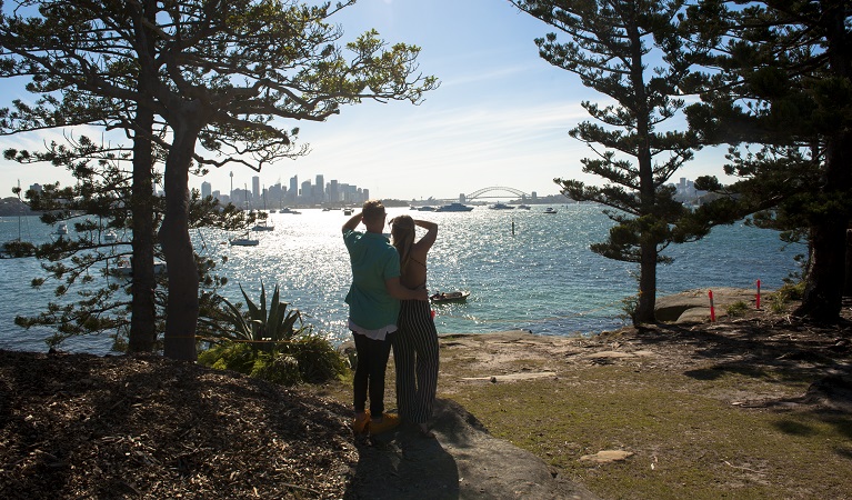 People looking out over Shark Island on New Years Eve. Photo &copy; Roslyn Sharp